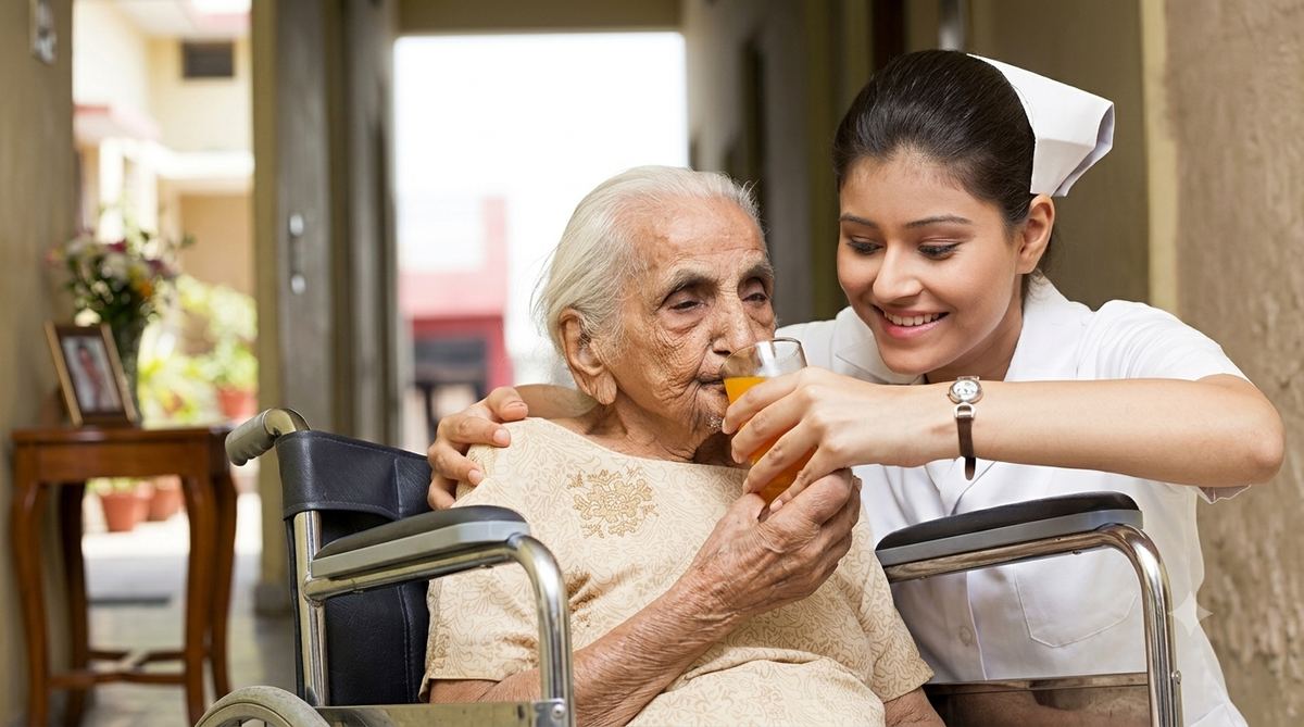 Vital Touch caregiver assisting an elderly patient at home in Bengaluru